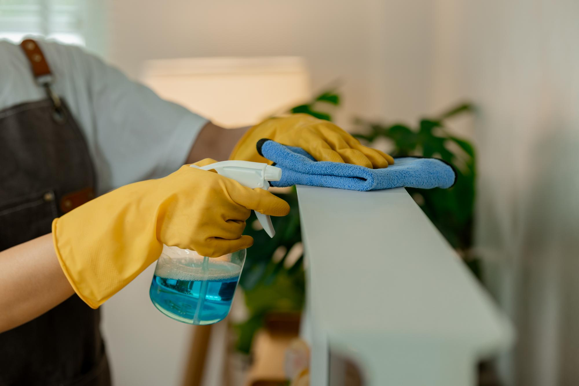 A specialist cleaning a kitchen surface